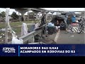 Moradores acampam na beira da estrada na Grande Porto Alegre