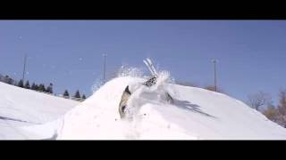 Skier slams into the side of a snow ramp