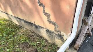 Step cracking in a block foundation and the possible causes.