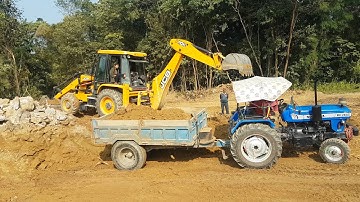 JCB Backhoe Cutting Mud and Loading in Tractor - JCB Machine at Work