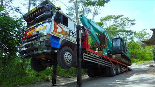 Self Loading A Kobelco Excavator Onto Transport Truck