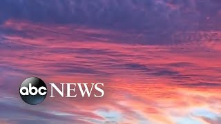 New York City sunset lights up sky across Hudson River