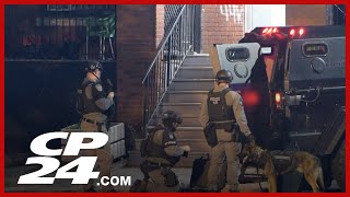 Hamilton police conduct raids in search of murder suspect