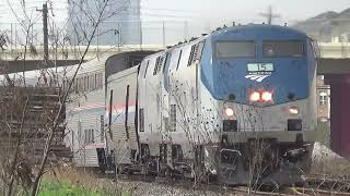 Amtrak heads out of station across the diamond then stops quickly
