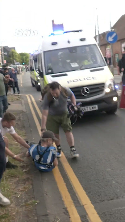 Moment under-siege cops DRIVE INTO protester amid chaos over migrant ‘sex assault’