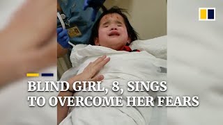 Blind girl, 8, sings to overcome her fears in hospital