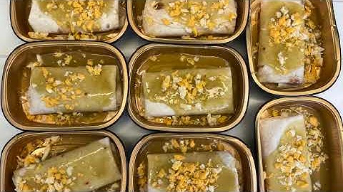 Chef robot assembling smothered burritos