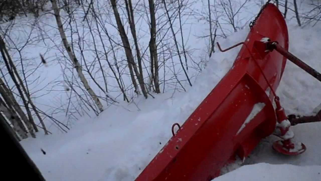 Grader snow plowing. YouTube