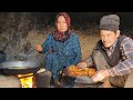 Lifestyle of a young mother in a cave with a cold winter  delicious traditional cooking in village