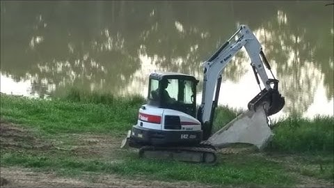 Bobcat E42 Excavator Pulling and Moving Big Concrete Slabs 05-16-17