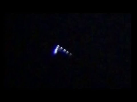 V shaped UFO & small white biological or technological UFOs that moves ...