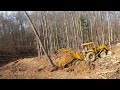 Doing Some Tree Work With a Backhoe