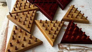 The creation of ￼Peg solitaire games made with hardwood from Africa.