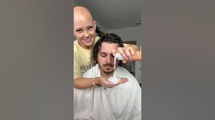 Doing his curly hair!!! He has enough hair for the both of us