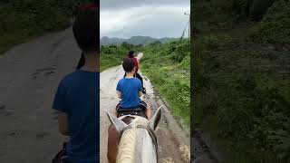 Riding horses in Valle de los Ingenious, Cuba