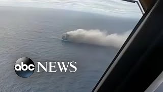 Portuguese Air Force transports crew of burning cargo ship carrying cars