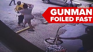 Store worker pulls gun on armed man, disarms him in dramatic confrontation