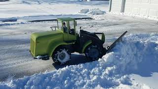 RC loader pushing snow