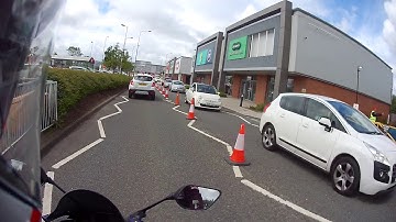 Idiot pulls out at a mini roundabout.