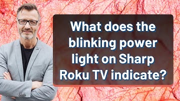 What does the blinking power light on Sharp Roku TV indicate?