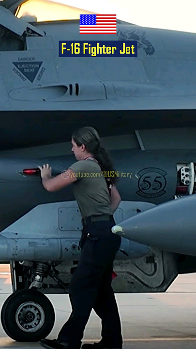 Maintenance Check on the Exterior of an F-16 Fighter Jet