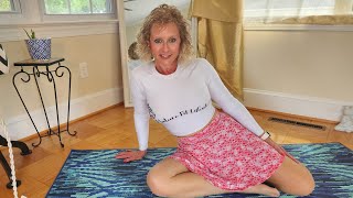 Yoga Art Stretching in pink skirt, stockings & mfl shirt