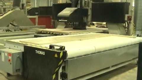 Komo CNC with AutoMHS with Conveyor