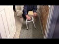 The old handyman makes a stool for kids