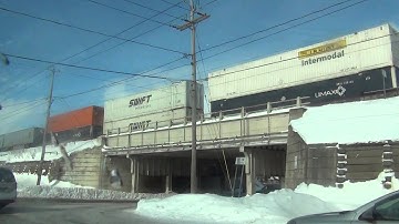 CSX Q018 Double Stack Train Goes Over a Bridge