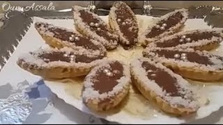 (حلويات العيد)حلوى بالكابريس ونواد كوكو ذوق  ولا اروع   gâteau a la noix de coco et caramels