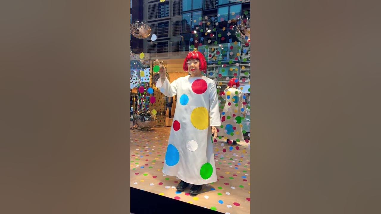 A lifelike robot of Japanese artist Yayoi Kusama paints spots on the  windows of Harrods in London as part of a display by luxury retailer Louis  Vuitton, “smiling” and “nodding” at passers-by.