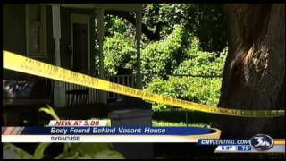 Body found behind vacant home