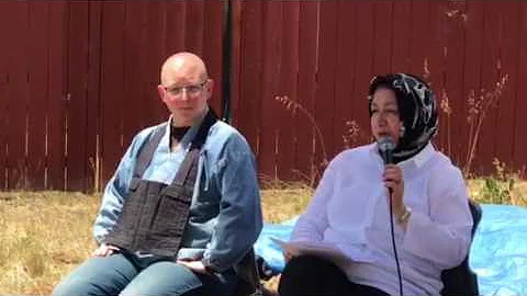 Maha Elgenaidi speaking at an interfaith Habitat for Humanity event