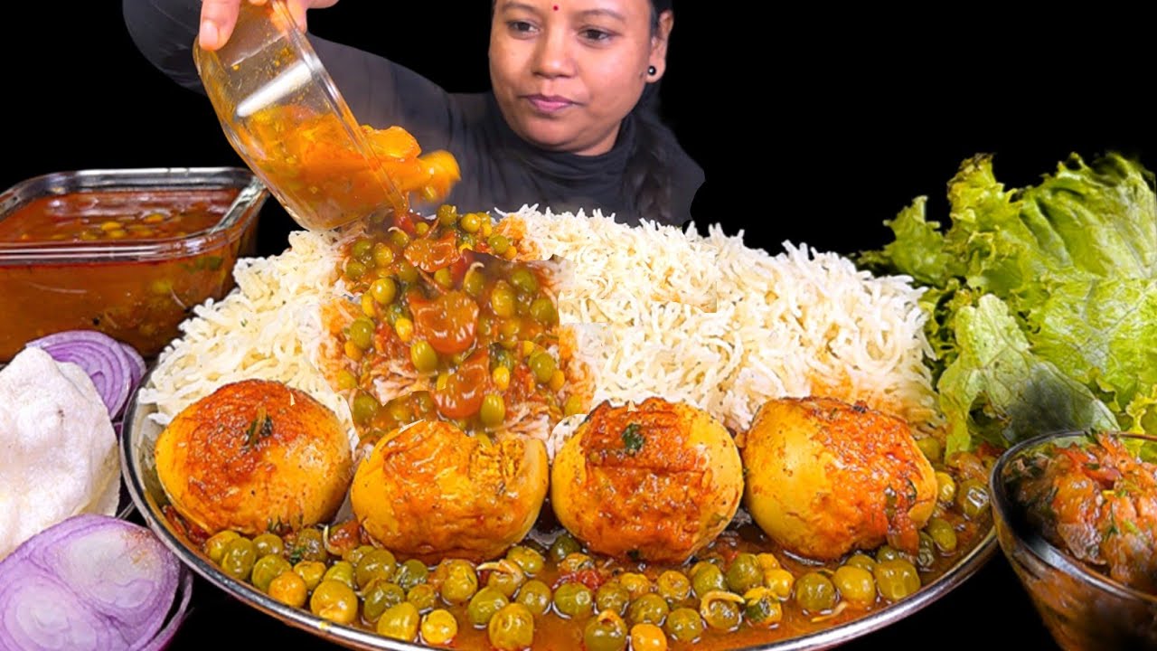 EATING ALOO MATAR EGG CURRY, BASMATI RICE, SPICY TOMATO CHUTNEY & SALAD PAPAD