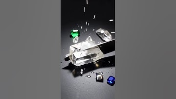 Ultra-sharp knife slices obsidian, quartz, sapphire, and emerald in cinematic slow motion.