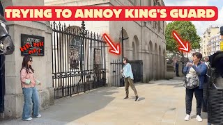 Stupid Tourist Tries to Annoy King's Guard with Her Moves.