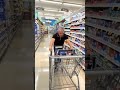 Man balancing shopping cart on chin.fhls-1348.mp4