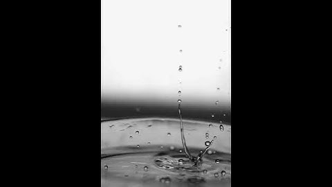 Explosion of water drops on the surface of boiling olive oil