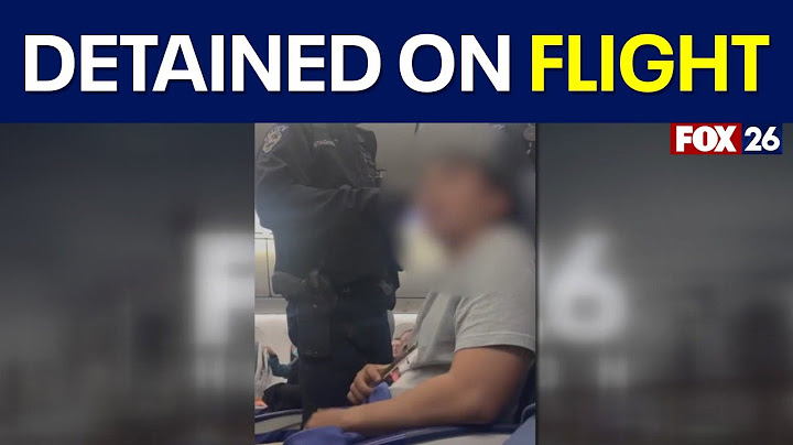 Houston-bound plane diverts to Seattle after passenger tries opening exit door mid-flight