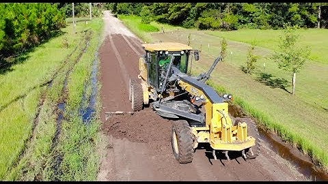 Heavy Equipment Road Grader and Dump Truck with Drone
