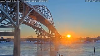 Sunrise at Port Huron featuring CCGS Samuel Risley and tug Pride 2-18- 25