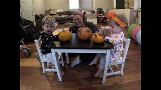 Twins paint their pumpkins