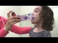 Longwood Pediatrics demonstrates how to use an Inhaler with a Spacer and Mask