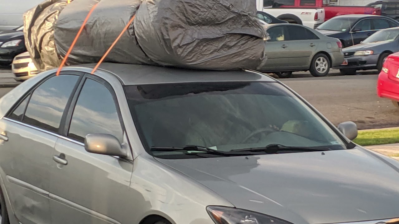 carrying a mattress on top of car