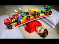 Mark builds a colorful bridge and helps the cars cross over it