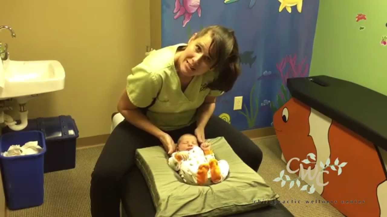 Dr. Lorie Lofquist Adjusts a 2-day Old Baby