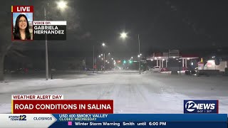Gabriela Hernandez checks out road conditions in Salina