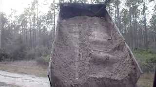 dump truck dumping dirt