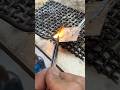 Soldering rectangular pendant in 18 karat yellow gold.