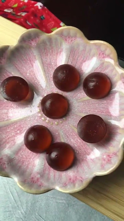 Delicious red candy arrangement on pink plate and wood#candyart #fooddesign #sweettreats